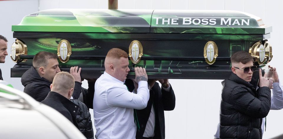 Devon Hennessy carrying his father Jason Snr’s coffin after his murder